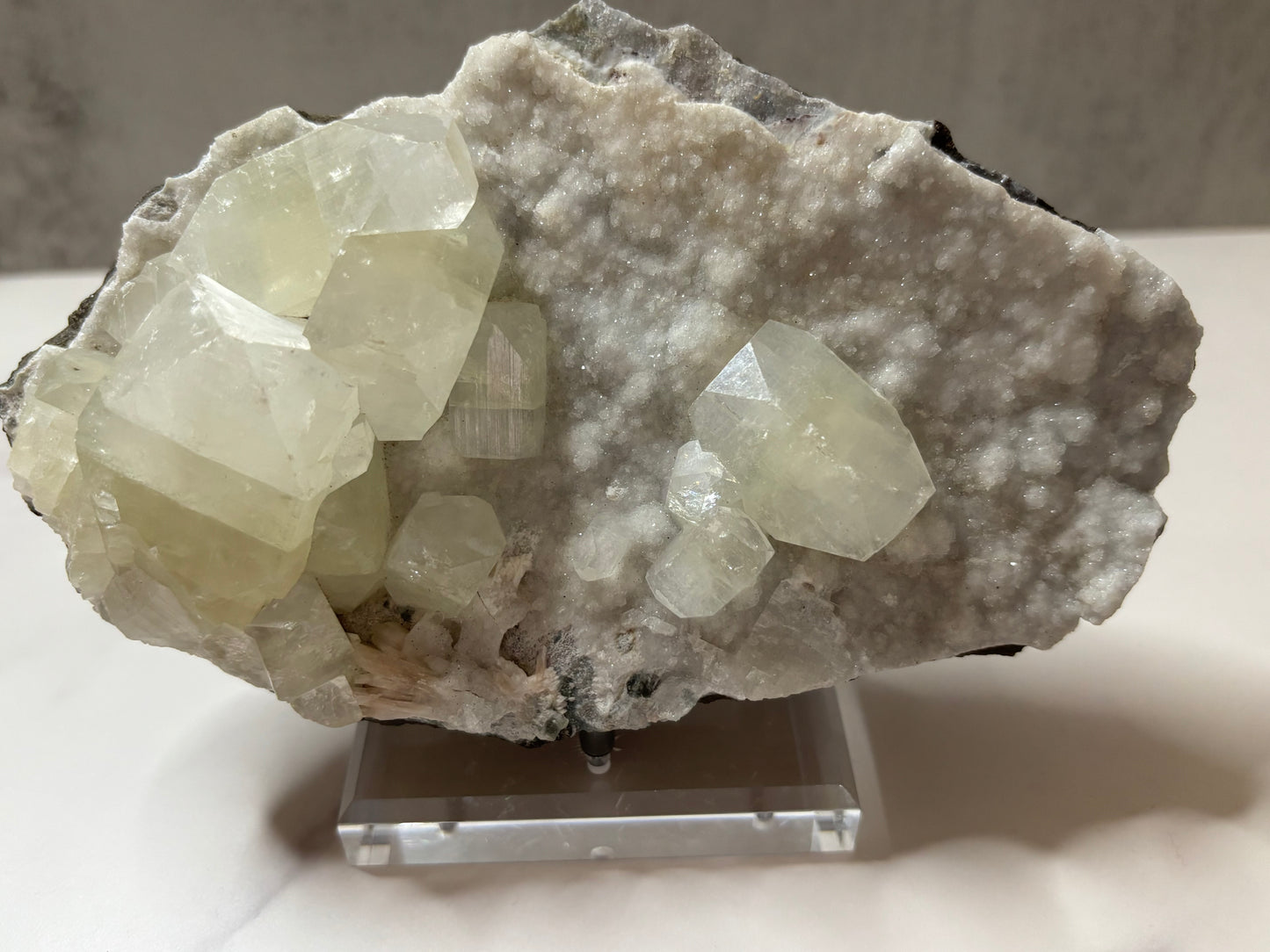 Crystal rock on a stand with a neutral background