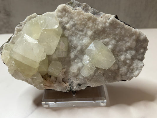 Crystal rock on a stand with a neutral background