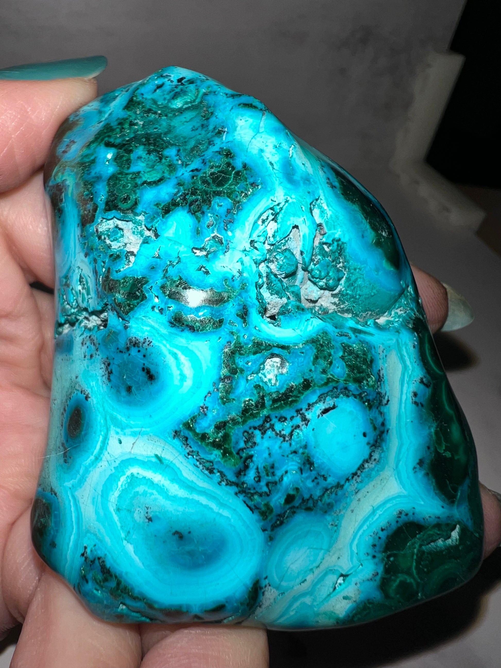 blue and green specimen with rings again gray background